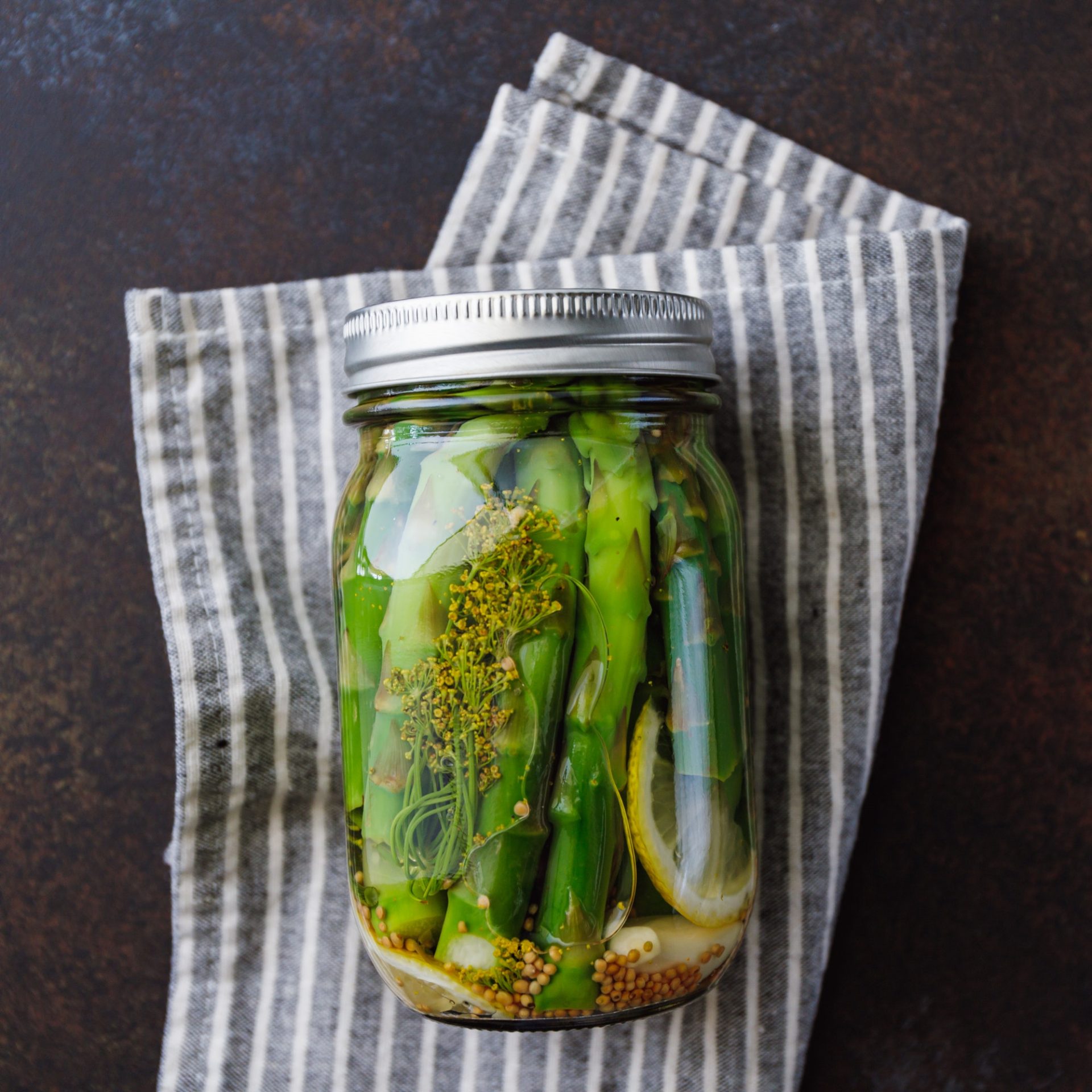 Top view of pickled asparagus in a ja