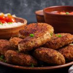 Juicy delicious meat cutlets on a dark table. Russian cuisine.