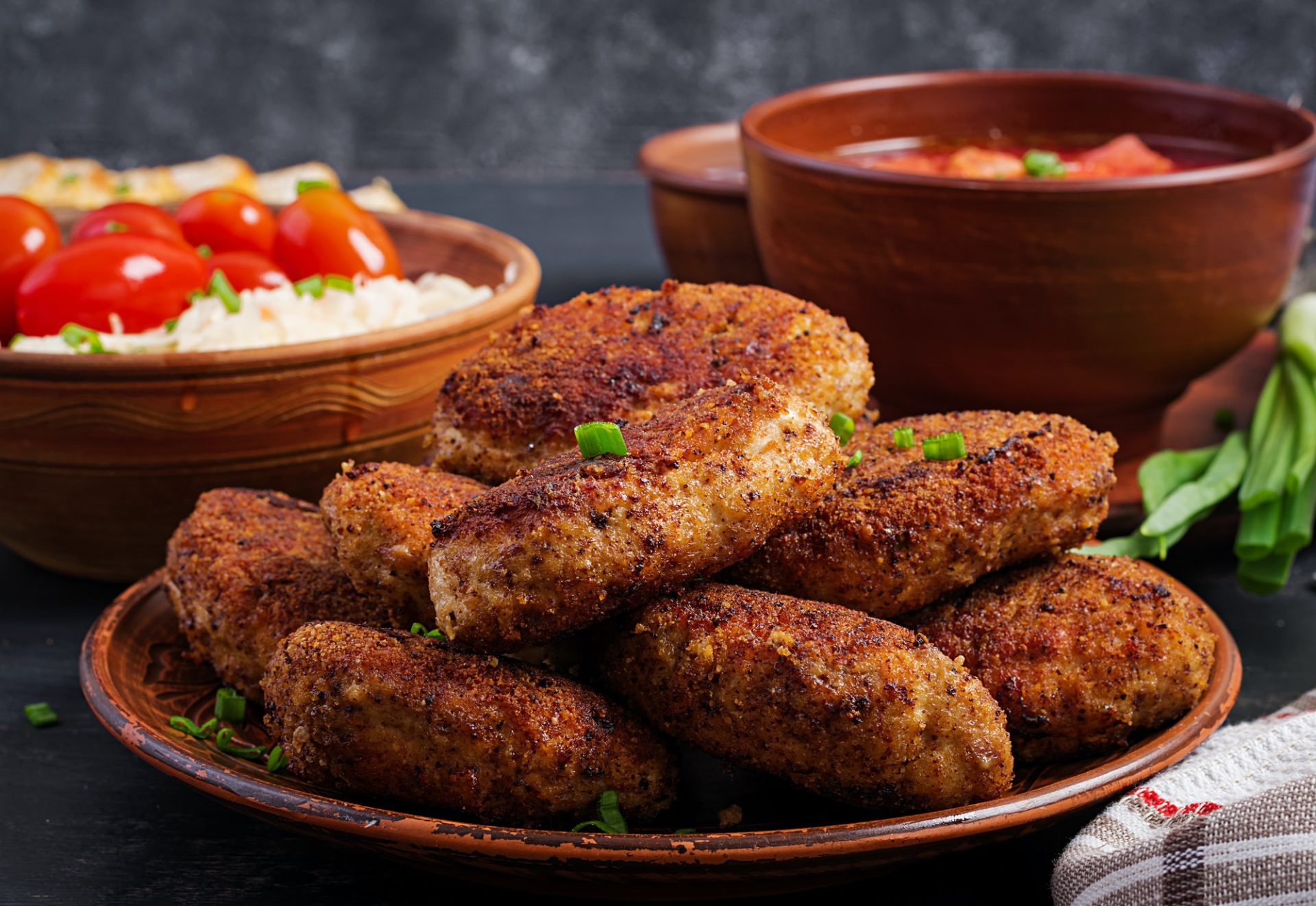 Juicy delicious meat cutlets on a dark table. Russian cuisine.